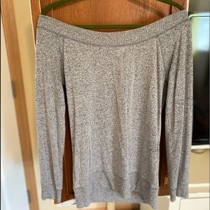 Sweater, off and on the shoulder.